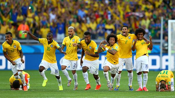Brazil celebrate after defeating Chile on penalties.