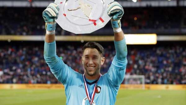 Brad Jones holds the Johan Cruijff Shield aloft after his stunning display in the Dutch Super Cup final.
