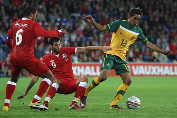 Adam Sarota evading the Welsh defence in the Socceroos 2-1 win in 2011.
