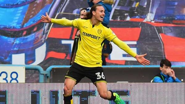 Jackson Irvine was the goal-scoring hero for Burton Albion against Aaron Mooy's Huddersfield Town in the Championship overnight.