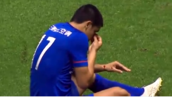 Tim Cahill clutches his face after a head clash in the CSL.