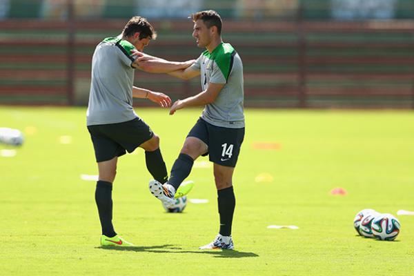 James Troisi and Mark Milligan prepare for another gruelling training session in Vitoria.