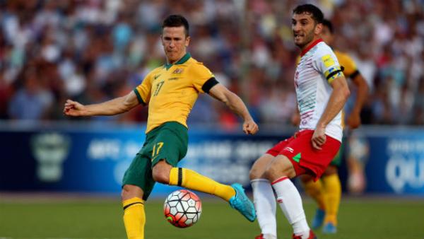 Socceroos midfielder Matt McKay has a shot on goal against Tajikistan.