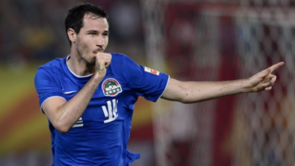 Defender Ryan McGowan celebrates scoring in the Chinese Super League.