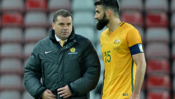 Ange Postecoglou with Mile Jedinak following the Socceroos' loss to England.