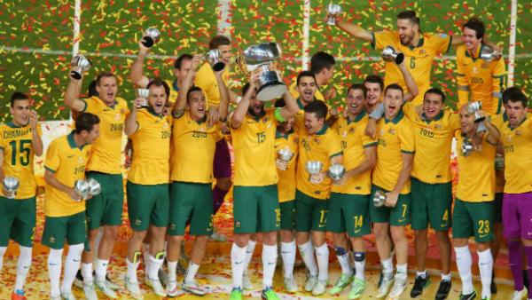 The Socceroos celebrate winning their maiden Asian Cup title.