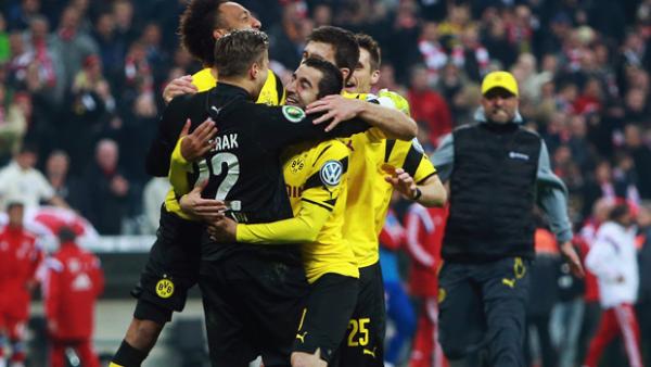 Mitch Langerak celebrates with teammates after Borussia Dortmund's shoot-out win.