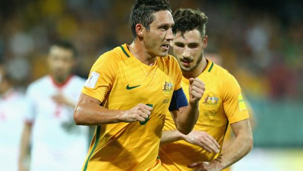 Mark Milligan celebrates after scoring in the Socceroos' 7-0 win over Tajikistan.