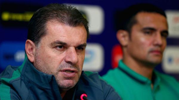 Socceroos coach Ange Postecoglou alongside Tim Cahill at Monday's press conference in Tajikistan.