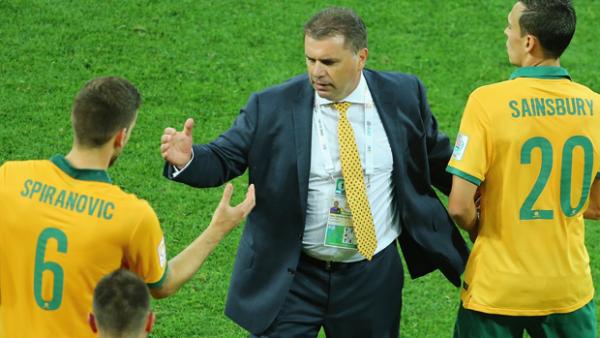 Postecoglou congratulates Socceroo defender Matt Spiranovic after Australia's 4-1 win over Kuwait.