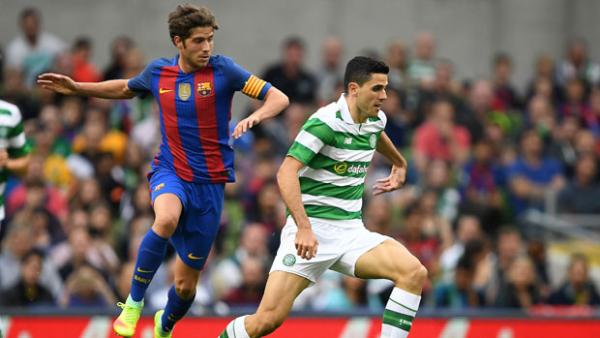 Tom Rogic drives forward during Celtic's 3-1 loss to Barcelona in the ICC.