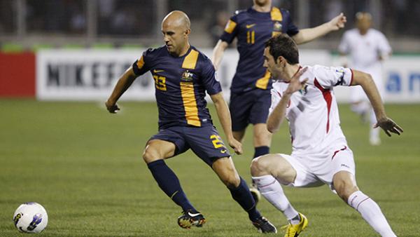Mark Bresciano controls possession in Australia's Asian World Cup qualifier loss to Jordan.