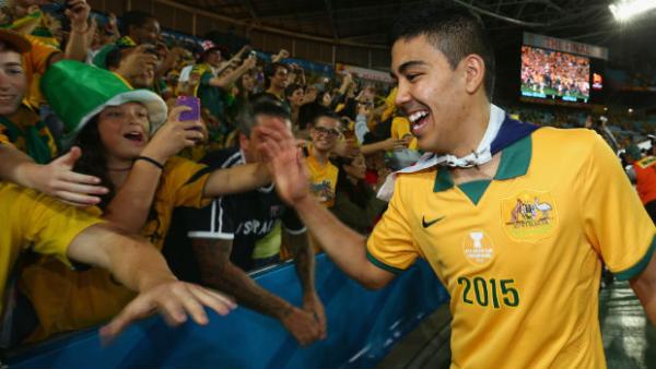 Mass Luongo celebrates Australia's Asia Cup win with Socceroos fans.