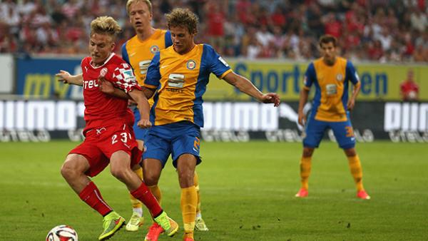 Ben Halloran sees off a challenge from Vegar Eggen Hedenstad of Braunschweig in Germany.