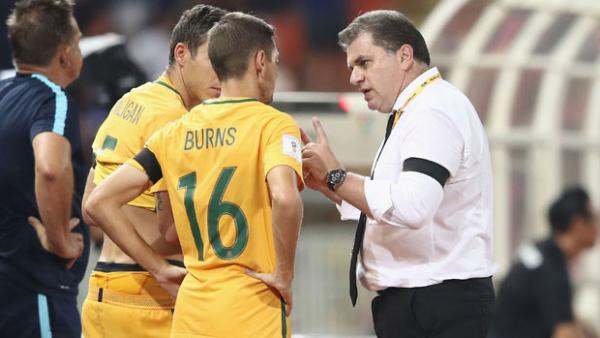 Ange Postecoglou gives instructions to Nathan Burns during Australia's 2-2 draw with Thailand.