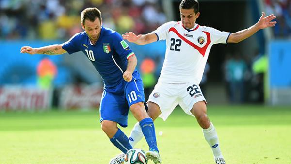 Cassano controls the ball past Jose Miguel Cubero of Costa Rica.