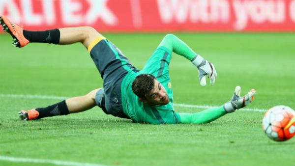 Caltex Socceroos goalkeeper Mat Ryan makes a save in training.