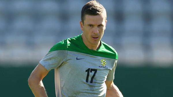 McKay dribbles the ball during a Socceroos training session.
