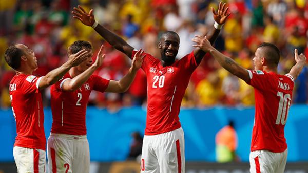 Swiss players celebrate at full-time after claiming win over Ecuador.