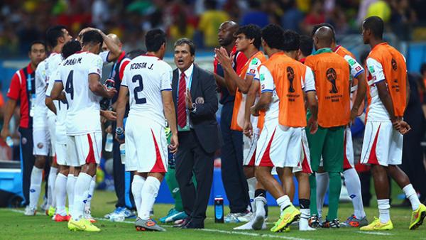 Costa Rica coach Jorge Luis Pinto rallies his players for extra-time against Greece.