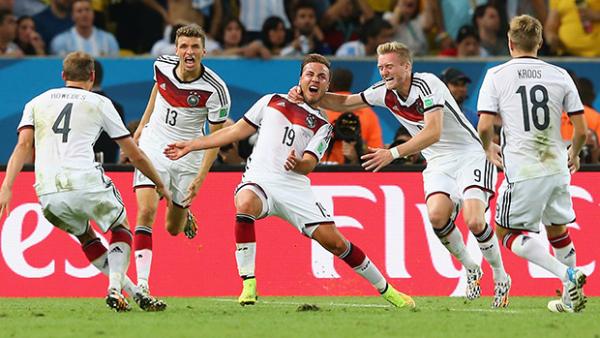 Germany's Mario Goetze celebrates with teammates after scoring in extra-time against Argentina.