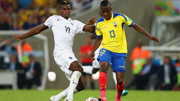 France's Paul Pogba challenges Enner Valencia in their 0-0 draw with Ecuador.