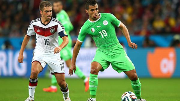 Lahm marks Saphir Taider during Germany's 2-1 win over Algeria.