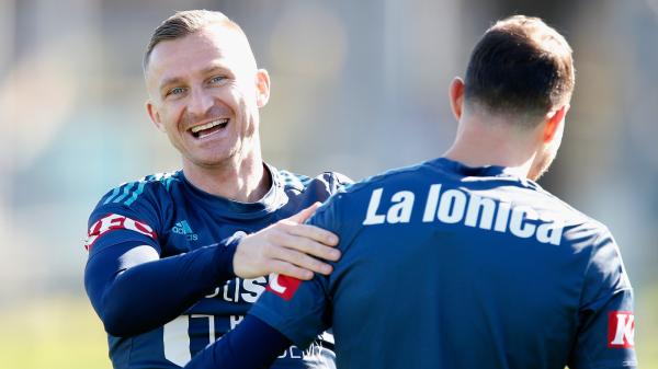 Melbourne Victory star Besart Berisha with Socceroos midfielder James Troisi.
