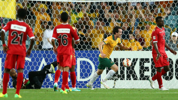 Robbie Kruse scores the Socceroos second goal against Oman at Stadium Australia.