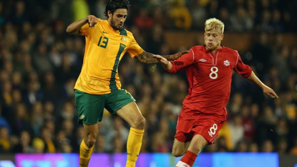 Rhys Williams in action for the Socceroos against Canada in 2013.