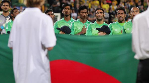 Bangladesh players lineup prior to their clash with the Socceroos in September.