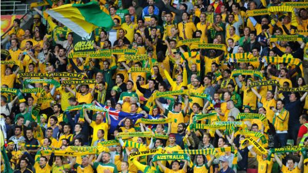 Socceroos supporters get behind the team at the Asian Cup opener in Melbourne.