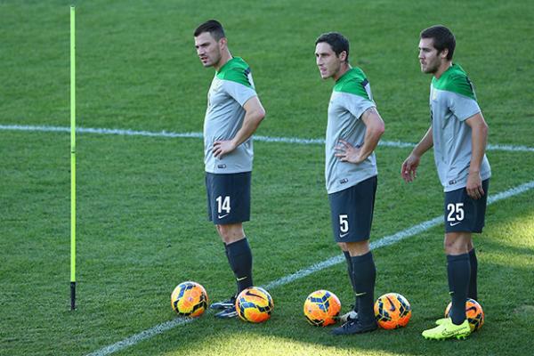 James Troisi training alongside fellow Socceroos squad members Mark Milligan and Josh Brillante in Gosford.