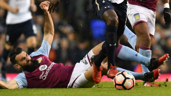 Mile Jedinak makes a tackle on Spurs midfielder Moussa Sissoko in the 3rd Round of the FA Cup.