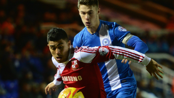 Socceroos midfielder Massimo Luongo on the ball for Swindon Town.