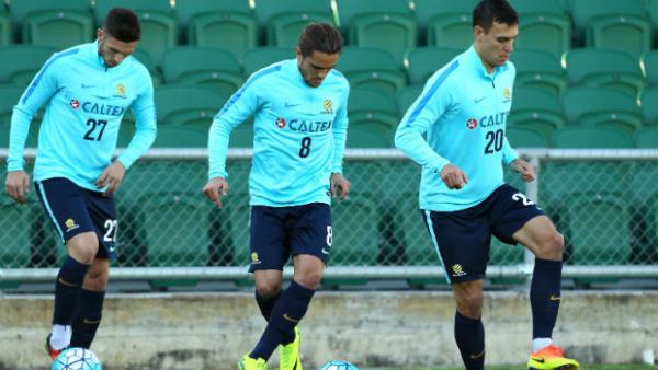 Trent Sainsbury alongside Apostolos Giannou and Josh Risdon on the training ground in camp with the Caltex Socceroos.