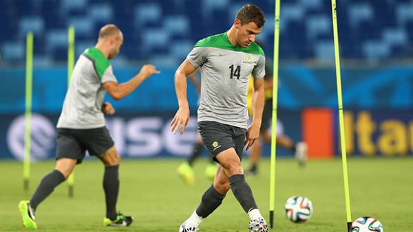 Socceroos James Troisi and Mark Bresciano in training at the World Cup.