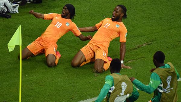 Cote D'Ivoire's Gervinho and Didier Drogba celebrate after going ahead against Japan.