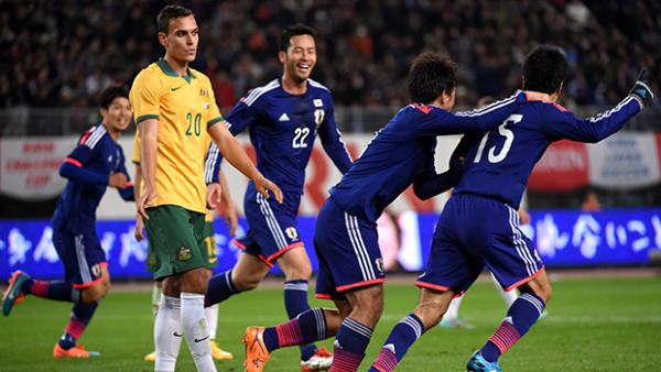 Japan's Yasuyuki Konno celebrates opening the scoring in Osaka.