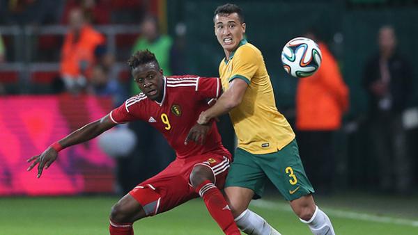 Jason Davidson and Divock Origi vie for possession.