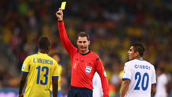 Williams shows Enner Valencia of Ecuador a yellow card during the match between Honduras and Ecuador.