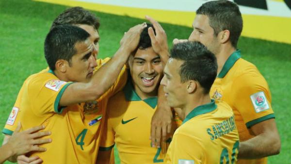 Socceroos players congratulate Massimo Luongo after he scored against Kuwait.