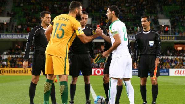 Caltex Socceroos skipper Mile Jedinak shakes hands with Iraq captain Saad Abdulameer when the two sides met in Perth.
