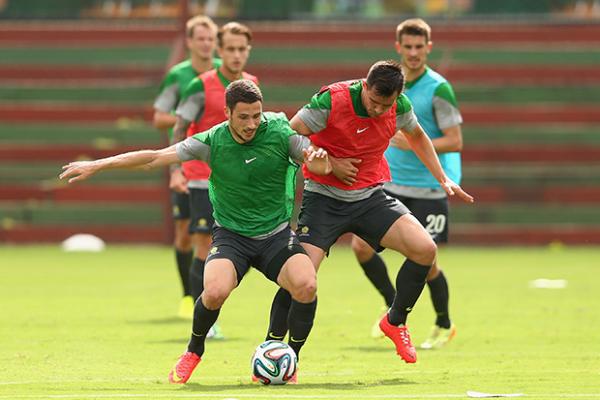 Matthew Leckie and Bailey Wright jostle for possession at Socceroos training.