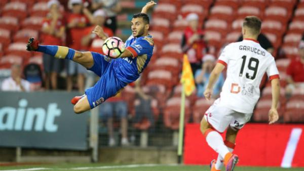 Jets attacker Andrew Nabbout shoots past Adelaide defender Ben Garuccio.