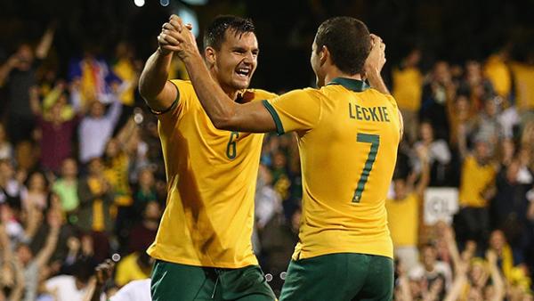Bailey Wright celebrates with Mathew Leckie after scoring against Saudi Arabia.