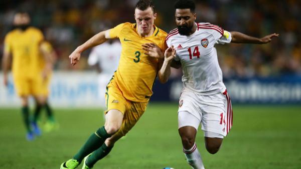 Brad Smith challenges for the ball with UAE's Abdelaziz Sanqour.
