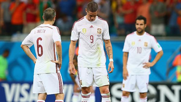 Spanish players show their disapointment during a 5-1 thrashing at the hands of Holland.