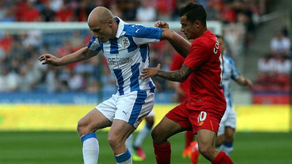 Midfielder Aaron Mooy on the ball in a pre-season friendly against Liverpool.