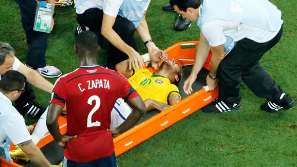 Neymar being stretchered off in Brazil's win over Colombia.